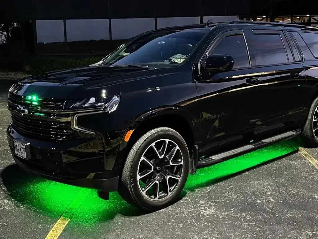 Lake Ride Pros black SUV with signature green running-board lighting
