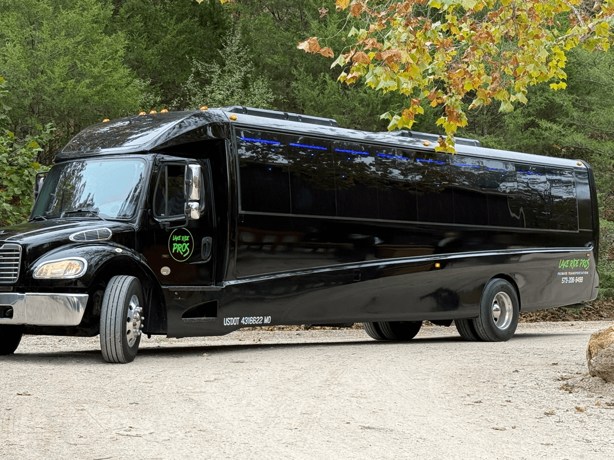 Lake Ride Pros Executive Shuttle Bus on a tree-lined drive